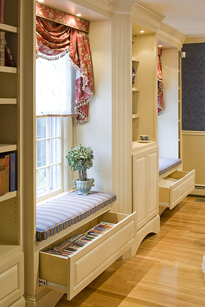 Built-in cabinetry in this media room created Traditional Interior Design