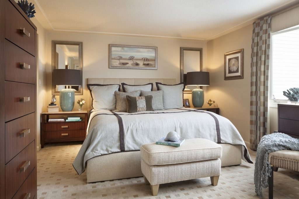Master Bedroom with upholstered bed and bedding in tones of blue, taupe and brown.  Boston area
